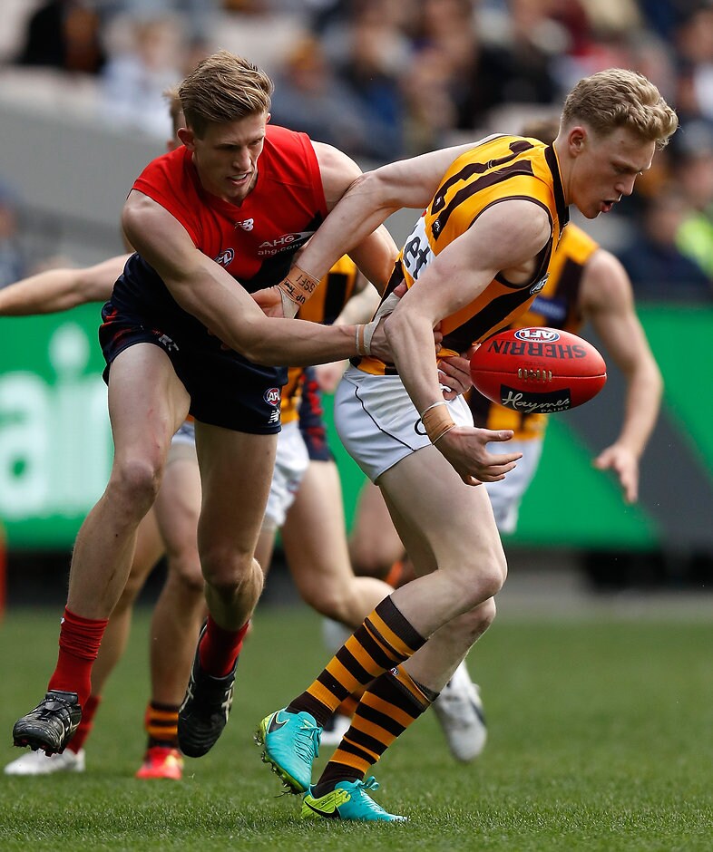 AFL 2016 Rd 20 - Melbourne v Hawthorn MELBOURNE, AUSTRALIA - AUGUST 06: James Sicily of the Hawks and Sam Frost of the Demons compete for the ball during the 2016 AFL Round 20 match between the Melbourne Demons and the Hawthorn Hawks at the Melbourne Cricket Ground on August 06, 2016 in Melbourne, Australia. (Photo by Michael Willson/AFL Media)